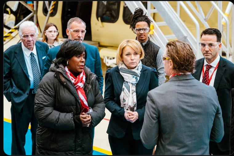 Jovita Neliupšienė (center, grey and white scarf), EU ambassador to the U.S., with Philadelphia Mayor Cherelle L. Parker (to her right, red and white scarf), at Leonardo helicopter factory on Red Lion Road in Northeast Philadelphia, on Jan. 22, 2024.