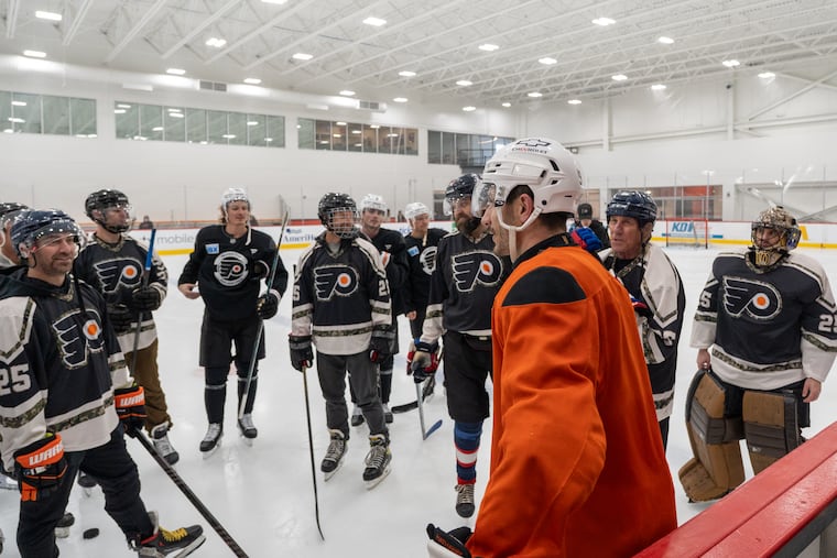 Garnet Hathaway, a big supporter of military-based charities, took some time to talk with several veterans on the ice Tuesday in Voorhees.