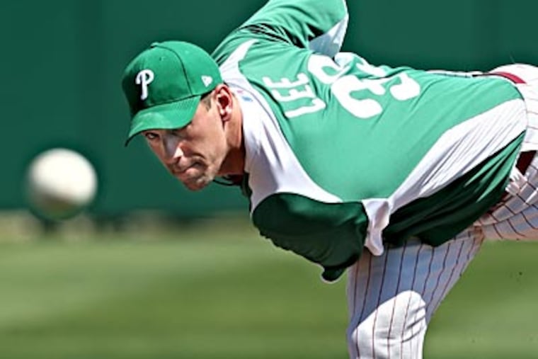 Cliff Lee and the Phillies wore green uniforms for St. Patrick's Day on Thursday. (David M Warren/Staff Photographer)