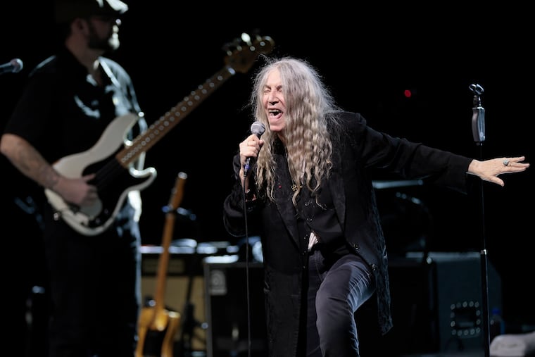 Patti Smith and her band and perform “Horses” on its 50th anniversary at the Met Philadelphia on Saturday, Nov. 29, 2025. Also pictured is Smith's son, Jackson Smith, on guitar.