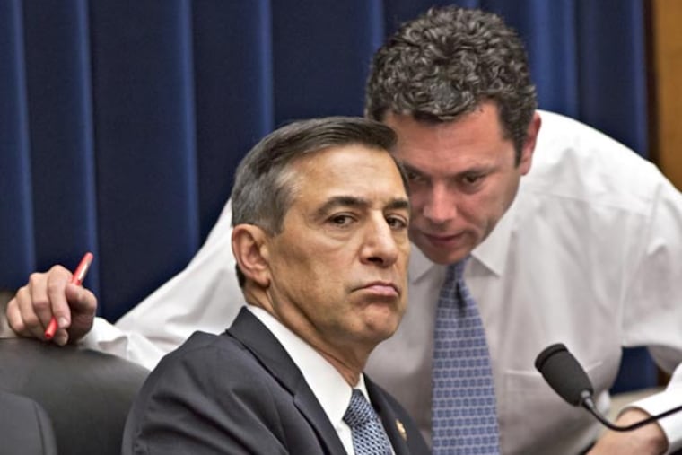 House Oversight Committee Chairman Rep. Darrell Issa, R-Calif., left, confers with Rep. Jason Chaffetz, R-Utah, right, at a House Oversight Committee hearing about last year's deadly assault on the U.S. diplomatic mission in Benghazi, Libya, on Capitol Hill in Washington, Wednesday, May 8, 2013. (AP Photo/J. Scott Applewhite)