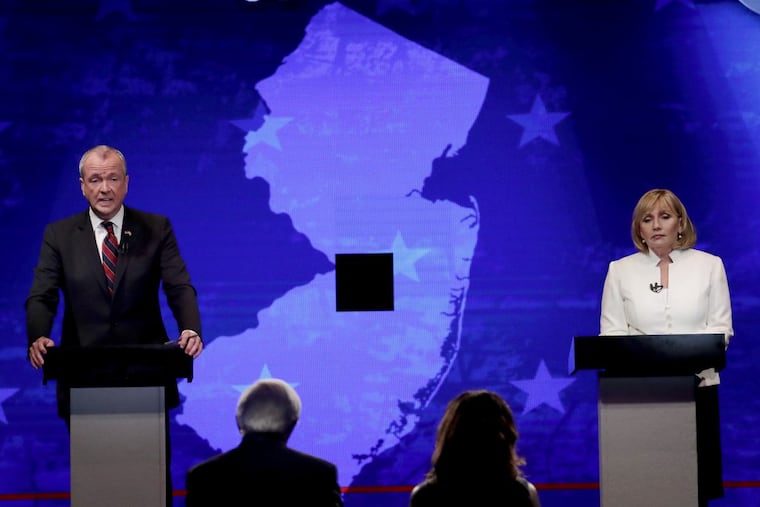 Democratic nominee Phil Murphy (left) and Republican nominee Lt. Gov. Kim Guadagno participate in a gubernatorial debate at the New Jersey Performing Arts Center, Tuesday, Oct. 10, 2017, in Newark, N.J.
