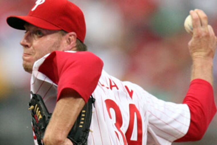 Roy Halladay tossed seven scoreless innings, allowing just one hit as he picked up his NL leading 13th win. (Steven M. Falk/Staff Photographer)