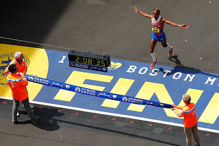 Meb Keflezighi of the United States crosses the finish line in first place to win the 2014 B.A.A. Boston Marathon on April 21, 2014 in Boston, Massachusetts. Meb becomes the first American winner of the Boston Marathon since 1983. Today marks the 118th Boston Marathon; security presence has been increased this year, due to two bombs that were detonated at the finish line last year, killing three people and injuring more than 260 others. (Photo by Jared Wickerham/Getty Images)