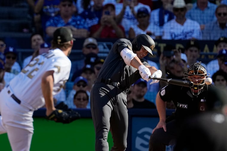 The Angels' Shohei Ohtani singles off the Dodgers' Clayton Kershaw during the 2022 All-Star Game in Los Angeles.