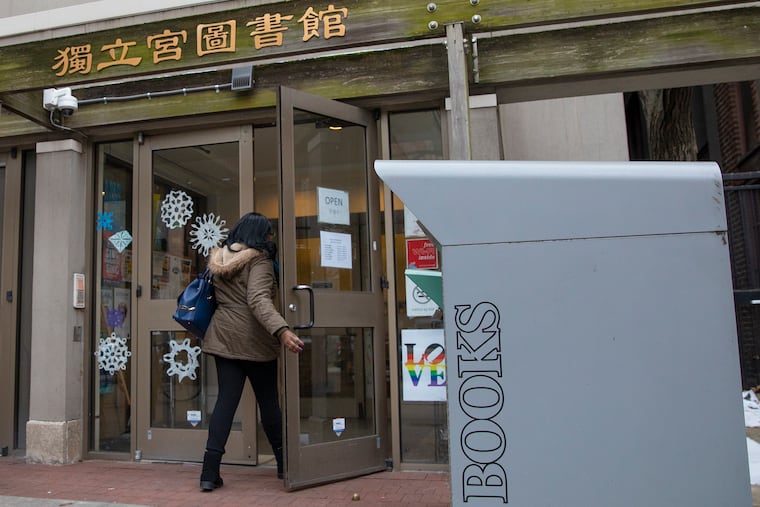 A woman enters the Independence Library, a Free Library of Philadelphia in Center City, last week.