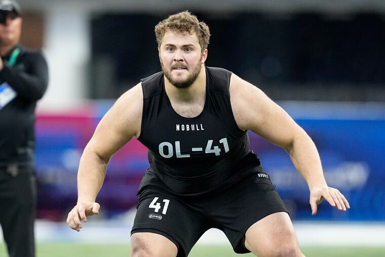 FILE - Northwestern offensive lineman Peter Skoronski runs a drill at the NFL football scouting combine in Indianapolis, Sunday, March 5, 2023. Skoronski looks like a custom-built NFL offensive lineman. (AP Photo/Darron Cummings, File)