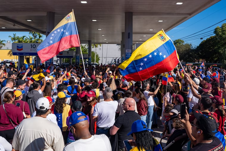 People celebrate after President Donald Trump announced Venezuelan President Nicolás Maduro had been captured and flown out of the country, in Doral, Fla., Saturday.