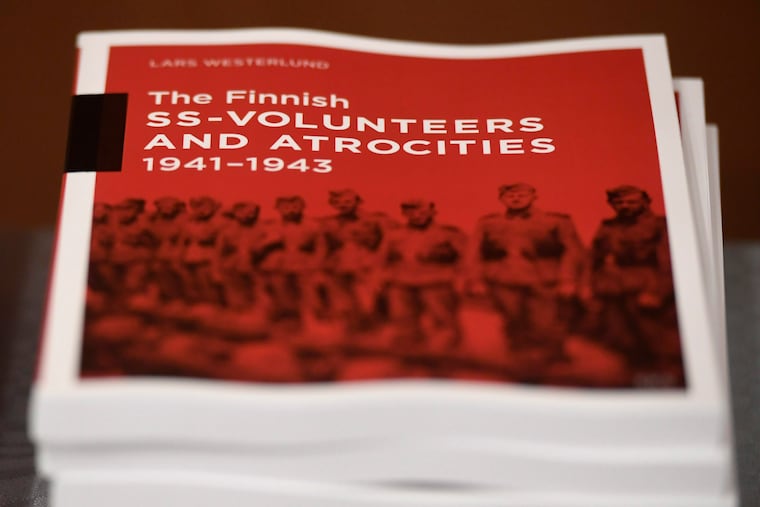 The research document entitled The Finnish SS-volunteers and atrocities 1941 - 1943 against Jews, detailing atrocities against civilians and Prisoners of War in Ukraine and the Caucasus Region, pictured in Helsinki, Finland, on Friday Feb. 8, 2019.