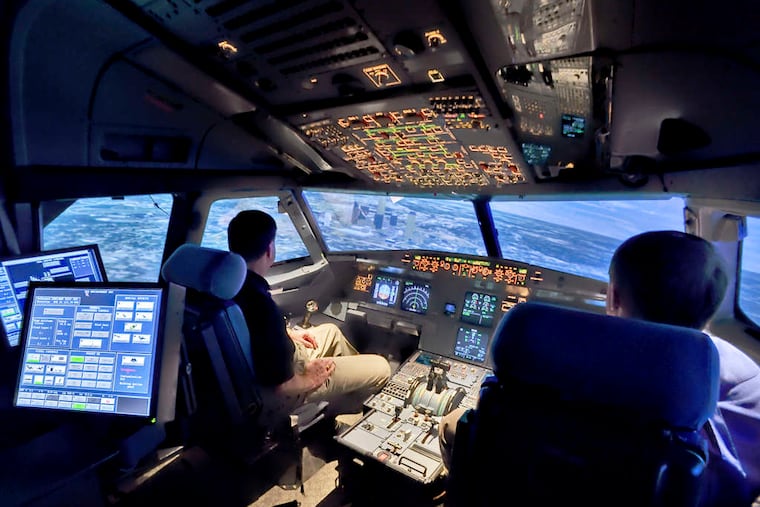 An Airbus A320 flight simulator. U.S. rules mandate two people in a cockpit at all times during commercial flights. The captain of the Germanwings Airbus A320 that crashed in the Alps had left the cockpit before the copilot barricaded himself in.