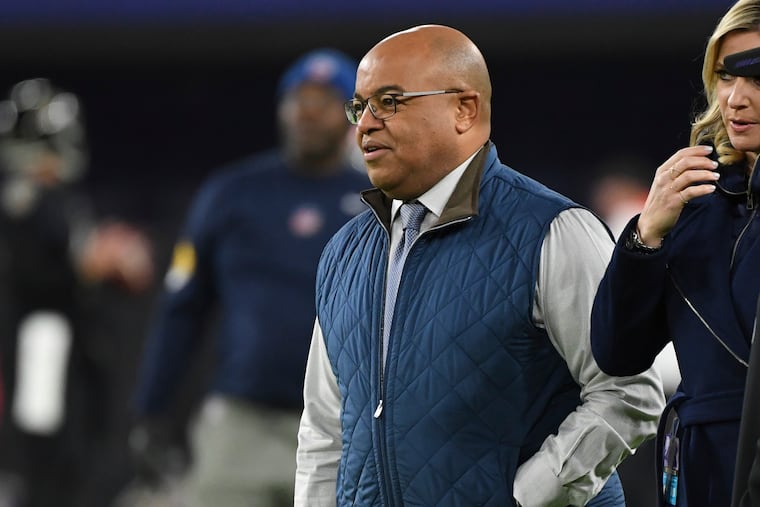 NBC Sports host Mike Tirico (center) at a NFL game last year.