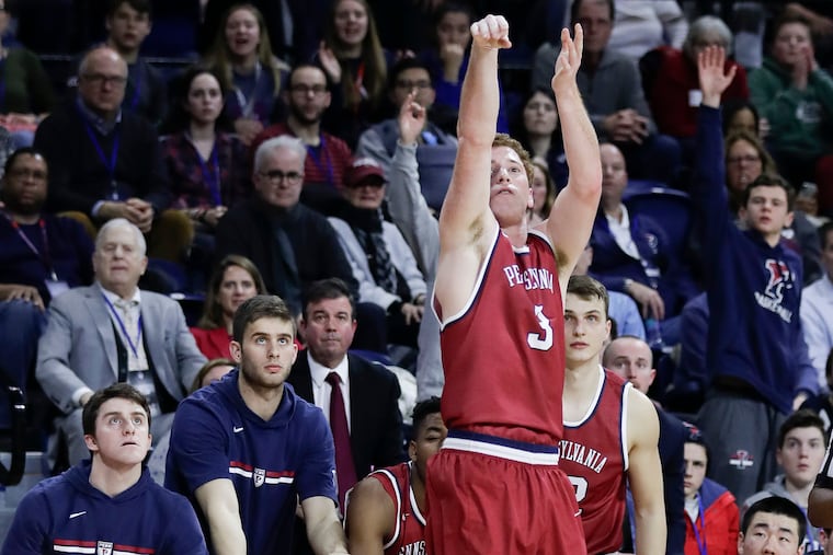 Penn guard Jake Silpe shoots a three point basket against Saint Joseph's at the Palestra on Saturday, January 26, 2019.