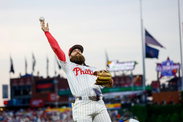 The Phillies' Brandon Marsh throws a baseball to fans before the start of the All-Star Game on Tuesday at Citizens Bank Park.