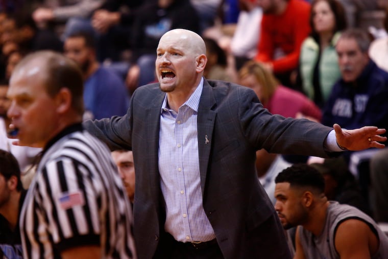Holy Family men's basketball coach R.C. Kehoe calls out to his players during the second half against Philadelphia University on Saturday (2/20/16) at Philly U. The host Rams went on to win, 76-66. (LOU RABITO / Staff)