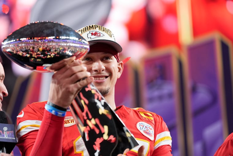 Chiefs quarterback Patrick Mahomes holds the Vince Lombardi Trophy after beating the 49ers in Super Bowl LVIII.