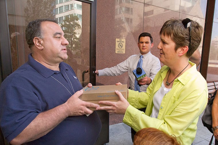 Former Waldron Mercy Academy teacher Margie Winters was not allowed in the building, but an archdiocesan representative accepted the box of signed petitions. CHARLES FOX / Staff Photographer
