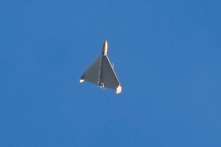 A drone is seen in the sky seconds before it fired on buildings in Kyiv, Ukraine, on Monday.