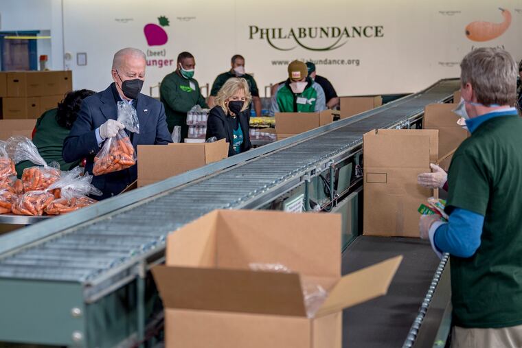 The president and first lady Jill Biden joined others on the assembly line, packing boxes of food destined for local food pantries.