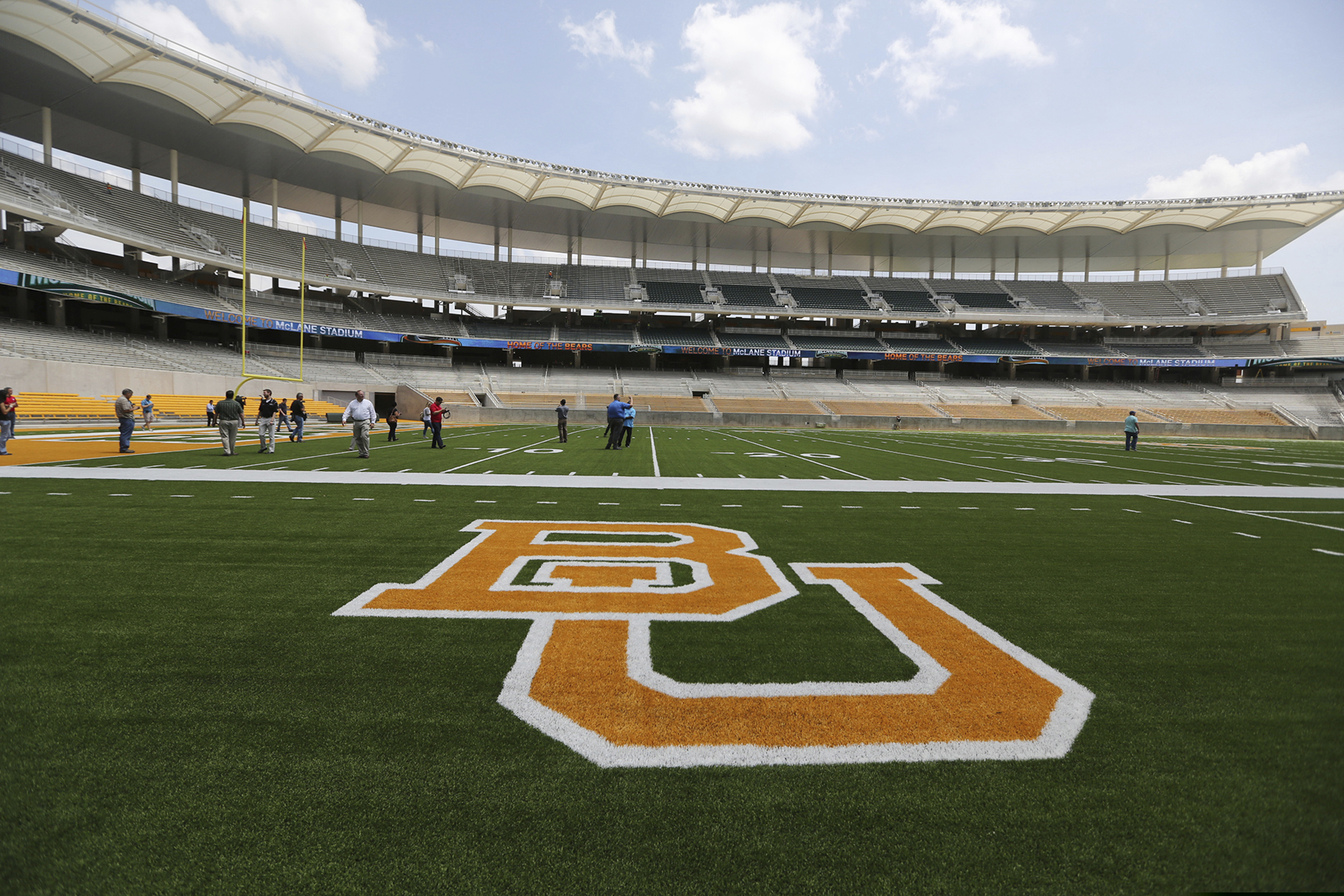 In this Aug. 18, 2014, file photo, the Baylor University logo is displayed on the football field at McLane Stadium in Waco, Texas. A federal judge has sanctioned the Philadelphia-based law firm of Pepper Hamilton for failing to turn over documents related to lawsuits filed against the school by 15 women alleging sexual assault and other misconduct.