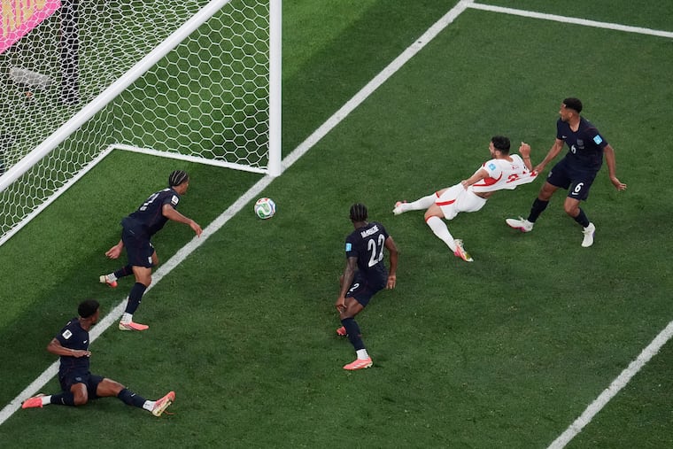 Turkey's Kaan Ayhan (second from right) scoring the last-second winning goal against the U.S.