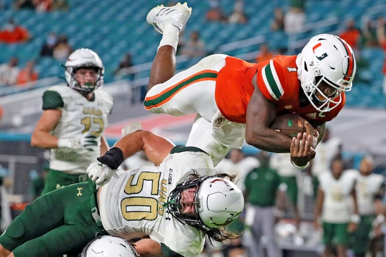 Miami quarterback D'Eriq King (1) leaping for a second-quarter touchdown against UAB on Sept. 10.