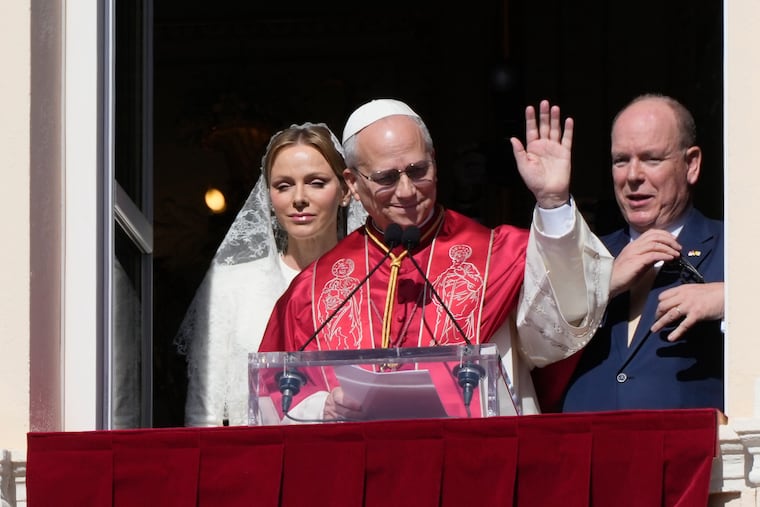 Pope Leo XIV, Princess Charlene of Monaco, and Prince Albert of Monaco appear at the Gallery of Hercules balcony at the Prince's Palace in Monaco-Ville, Monaco, on Saturday.