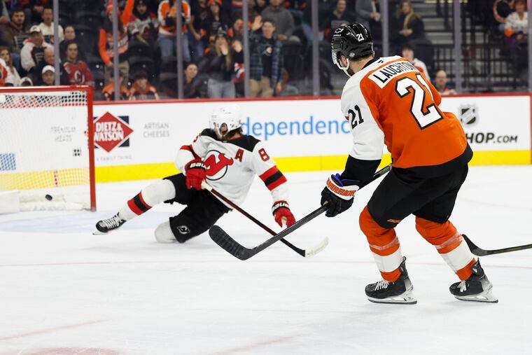 Flyers center Scott Laughton watches his empty-net goal past New Jersey Devils defenseman Johnathan Kovacevic late in the third period on Jan. 27.