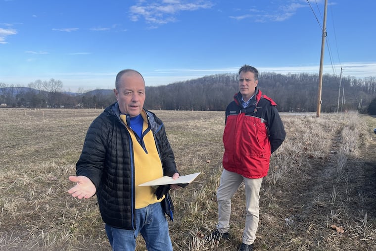 Matthew Murray, left, and Nathaniel Guest, right, are among a group of residents fighting an Upper Pottsrove Township plan to build a new municipal complex on a farm the township originally purchased as open space.