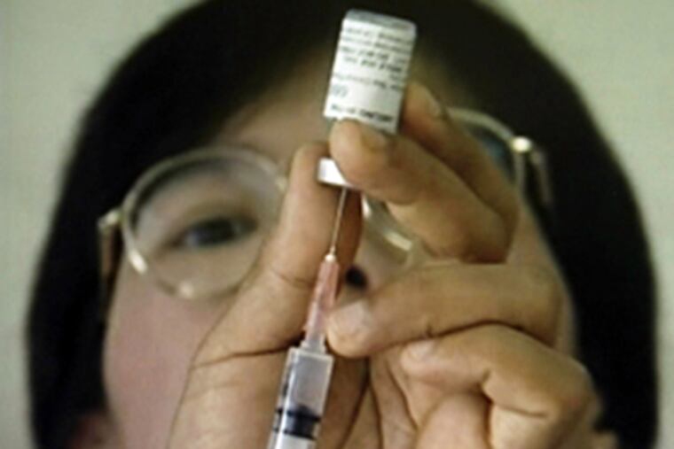 This undated photo released by the U.S. Military HIV Research Program shows a researcher during the Thai phase III HIV Vaccine Trial. (AP Photo/MHRP)