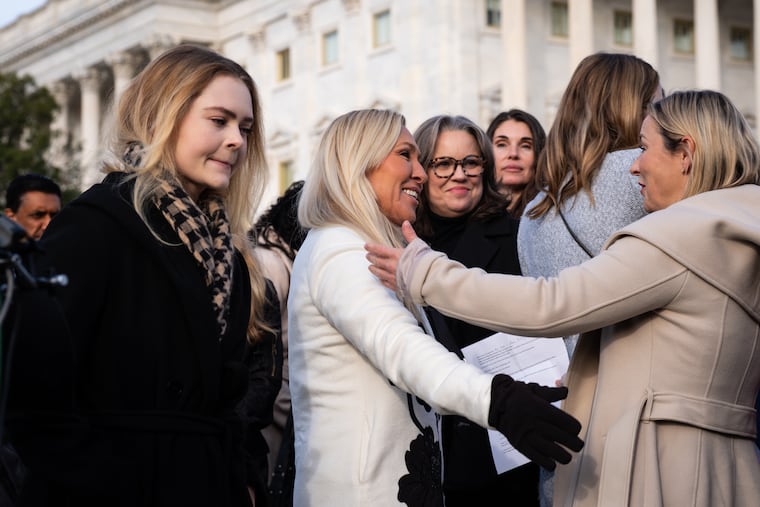 Rep. Marjorie Taylor Greene (R., Ga.) with victims of convicted sex offender Jeffrey Epstein on Nov. 18 at the Capitol.