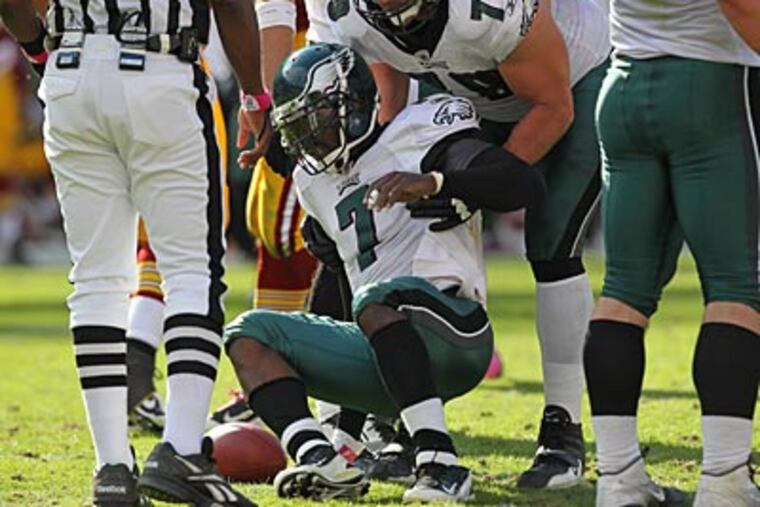 Many thought Michael Vick was concussed after taking a hit that caused him to leave last week's game. (Michael Bryant/Staff Photographer)