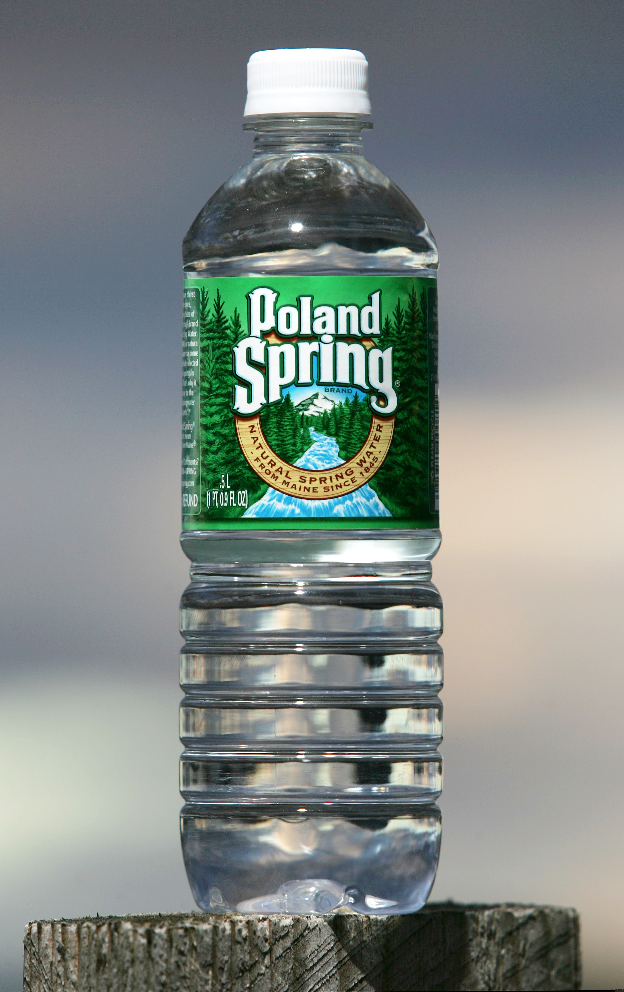 FILE - This Nov. 10, 2005, file photo shows a bottle of Poland Spring water in Fryeburg, Maine. The Maine-based company announced a plan on Monday, June 3, 3019, to use 100% recycled plastic for all its noncarbonated water containers by 2022. (AP Photo/Robert F. Bukaty, file)