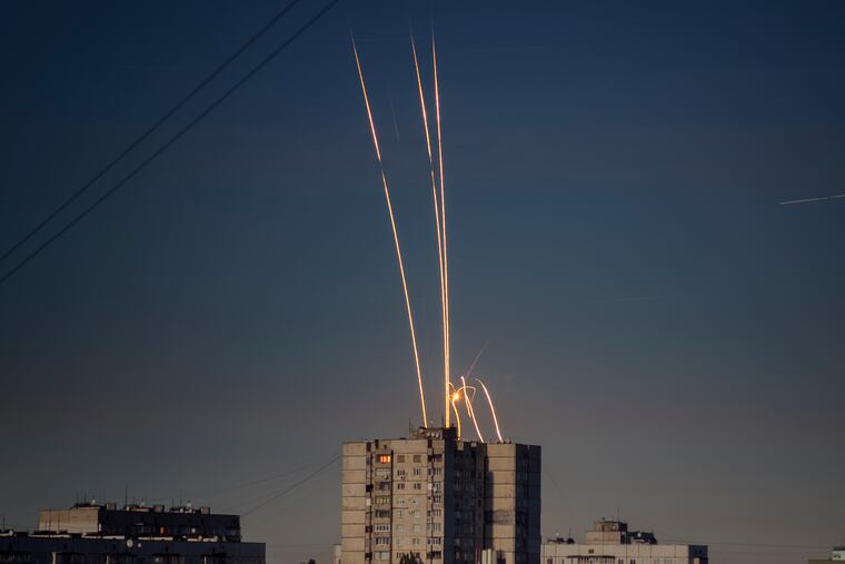 Russian rockets launched against Ukraine from Russia's Belgorod region are seen at dawn in Kharkiv, Ukraine, early Friday.