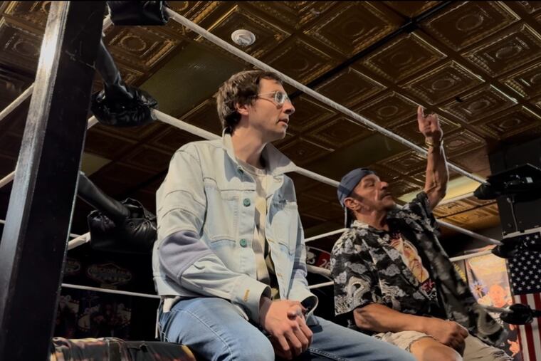 Award-winning filmmaker Joe Clarke, left, sits ringside with Terry Brunk, better known as Sabu.
