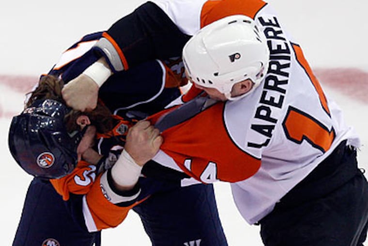 Ian Laperriere brawled with the Islanders' Brendan Witt during the first period of the Flyers' win. (Seth Wenig/AP)