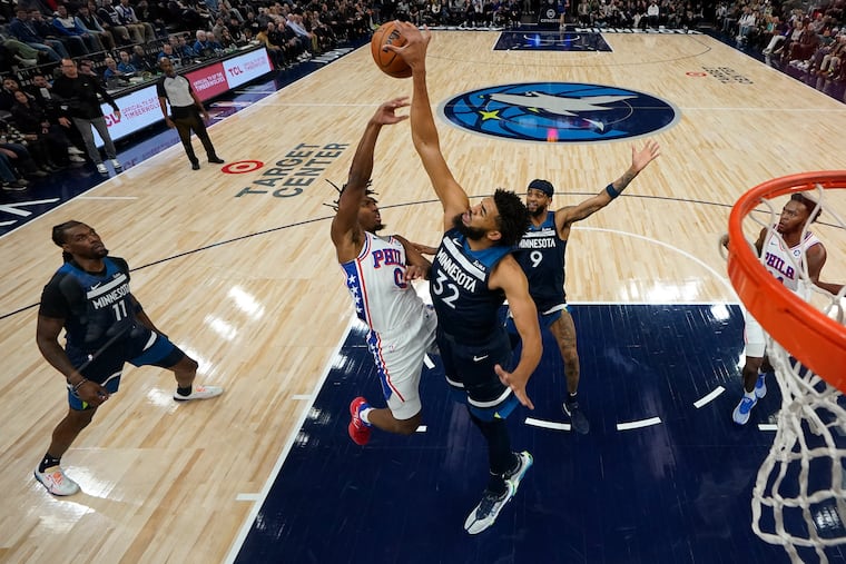Minnesota Timberwolves center Karl-Anthony Towns (32) blocks a pass by 76ers guard Tyrese Maxey during the first half Wednesday.