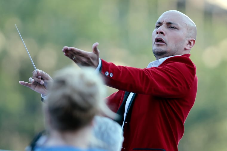 Philly Pops music director Chris Dragon conducting the "Pops on Independence" concert on Independence Mall on Thursday.