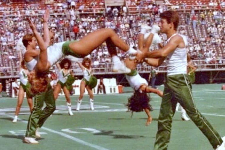 Mark Merschen (right) in action in the mid-1980s as one of the first male cheerleaders for the Eagles. Paul Kramer (partially obscured) is at left.