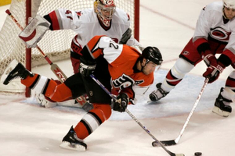 "I'm not going to miss the building, locker room or stands," Flyers forward Simon Gagne says of the Devils' arena. He's shown pursuing the puck Wednesday against the Hurricanes.