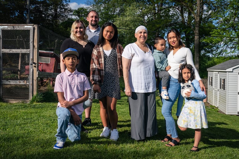 From left, Jyrus Lobeban, Tess McCahery, Benjamin O’Neill, Jirah Lobeban, Battalion Chief Linda Long, Aron O’Neill, Joyce Lobeban, and Bella O’Neill, shown here at Linda Long’s home with her family who gathered to celebrate her birthday, in Philadelphia, Saturday, May 6, 2023. Long is battling glioblastoma.