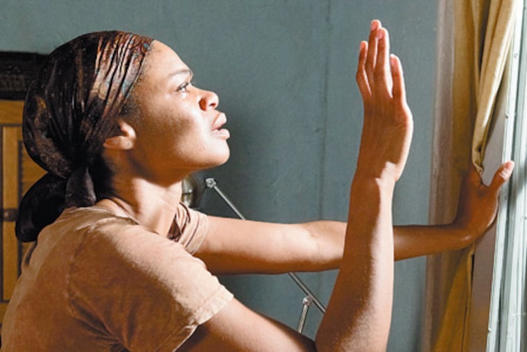 Kimberly Elise portrays the abused Crystal, above, in Tyler Perry’s film of Ntozake Shange’s 1975 play. “I surrendered fully to Crystal, but I had to purge her,” says Elise, adding that the cast, right, had “such reverence for the material.”