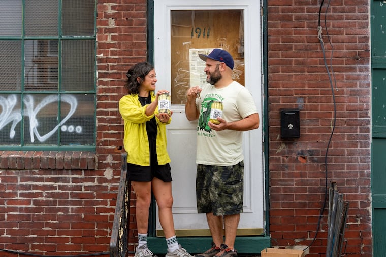 Fishtown Pickle Project owners Niki Toscani and Mike Sicinski outside their new building at 1911-13 N. Second St.