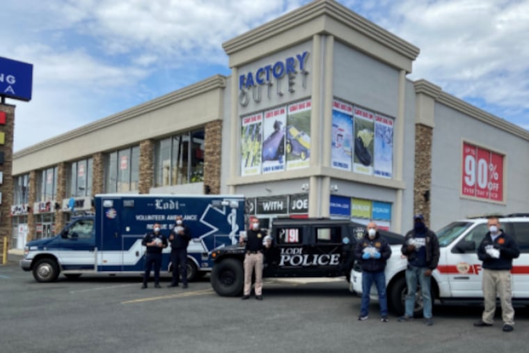 Lodi (N.J.) police with protective masks delivered by businessmen who started "Operation Batman" to supply equipment to workers on the front lines of the battle against COVID-19 pandemic.