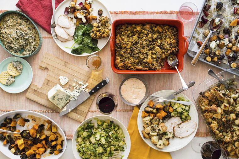 This October 2017 photo provided by Katie Workman shows food on the table at her apartment in New York. When you are making a big Thanksgiving dinner getting as much done ahead of time.