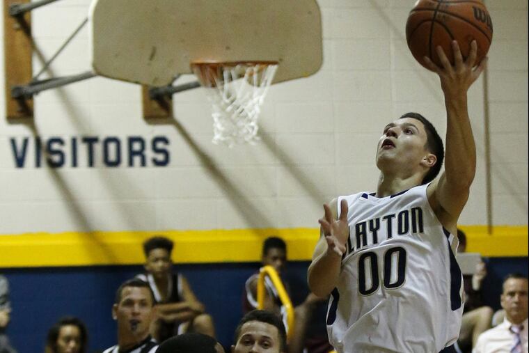 Clayton High’s Mahir Yilmaz (right) attempts a lay-up against Wildwood High’s Trayvon Young during the first-quarter of a game on Monday, Dec. 19, 2016. Yilmaz scored 31 points against Audubon on Monday.