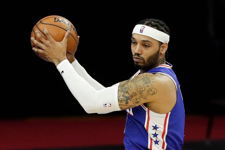 Sixers forward Mike Scott holding out the basketball against the Indiana Pacers on Monday.