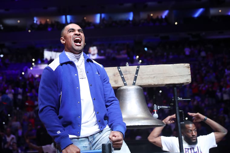 Eagles quarterback Jalen Hurts does his signature celebration after ringing the bell before the start of a game between the Philadelphia 76ers and the San Antonio Spurs at the Wells Fargo Center in Philadelphia on Saturday, Oct. 22, 2022.