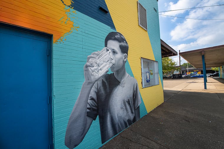 Murals are shown on Thursday, Oct. 7, 2021, at Cruz Playground. The City's Water Dept., Parks and Recreation and Mural Arts Philadelphia unveiled two sister murals called Drink More Tap at Cruz Playground and Penrose Recreation Center to address community distrust in tap water, in neighborhoods where residents drink bottled water. The murals, which feature local residents who were photographed for the project, were designed by Salvadoran artist CALO Rosa, who was commissioned by the City in 2019. The art projects are part of the Drink More Tap campaign, inspired in recent water consumption research conducted by Water Dept. and Penn.