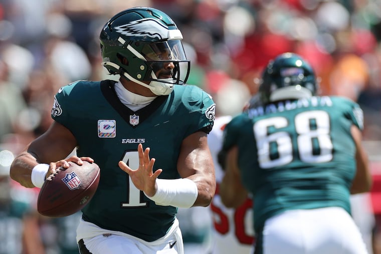 Eagles quarterback Jalen Hurts rolls out on third down during last year's loss to the Tampa Bay Buccaneers.