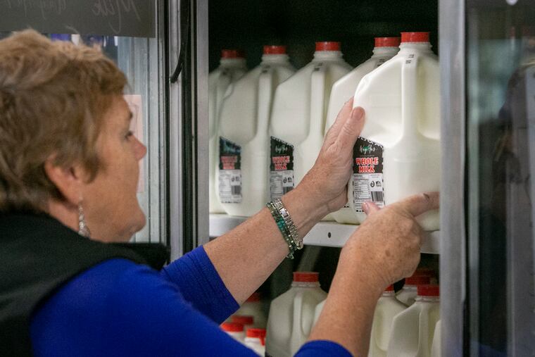 Dairy farmer Lolly Lesher in dairy section at Way-Har Farm Market in Bernville, Pa.